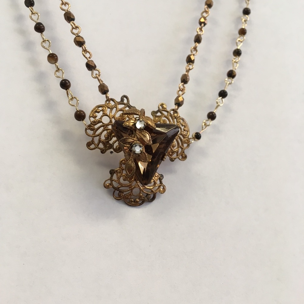 Antique pendant on dual chain beaded necklace